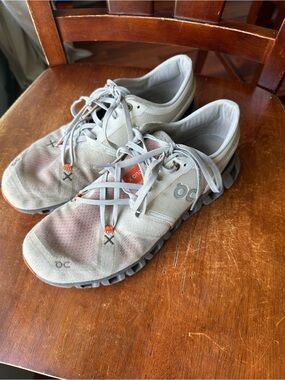 On Running Men's Athletic Shoes in Light Gray with Orange Accents